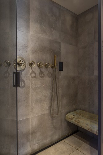 luxury bathroom design shower with waney edged oak bench
