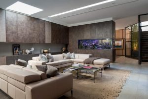 bespoke textured joinery in a family entertaining room and home cinema by roselind wilson design