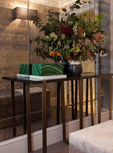 luxury entrance hallway with antique mirror glass and metal console table