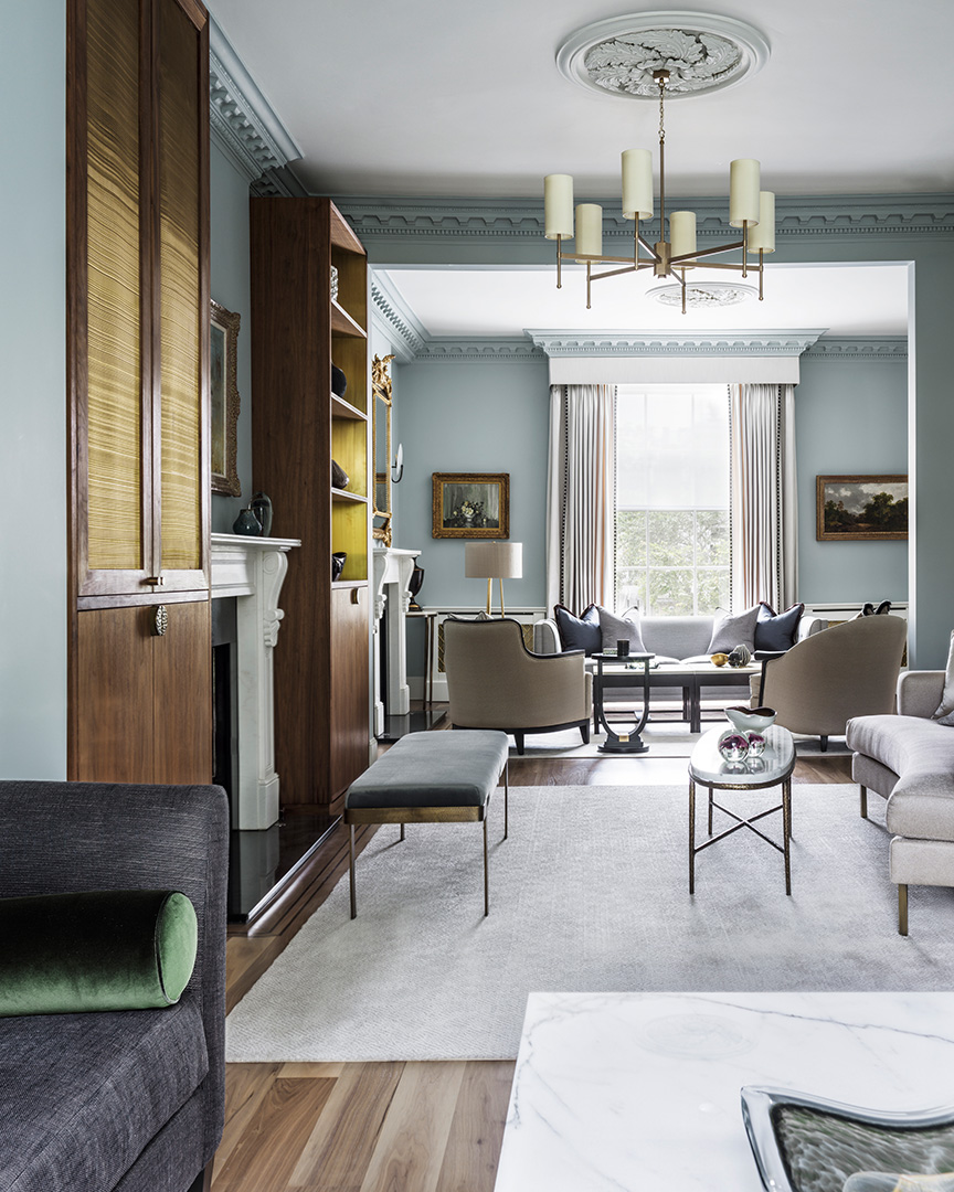 elegant blue living room with bespoke blue bench and oval marble coffee table