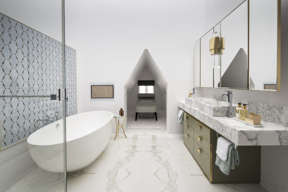 Luxurious marble bathroom with freestanding bath, spa daybed and bespoke marble bathroom vanity unit by interior designer Roselind Wilson Design
