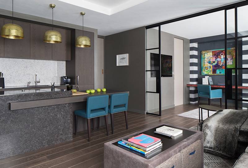 open plan kitchen and living room with metal-framed internal doors