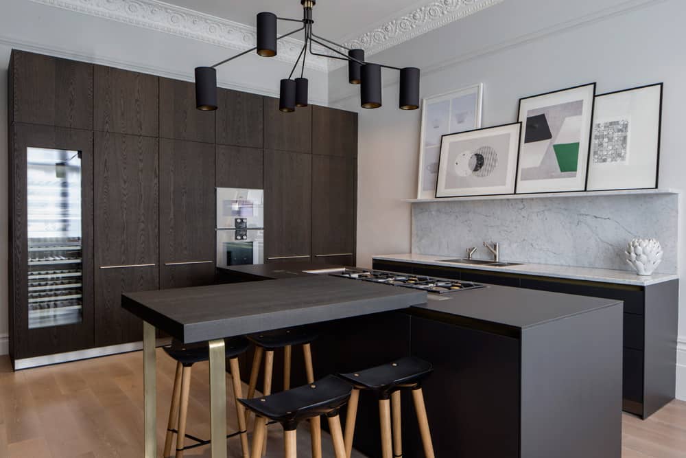 contemporary industrial kitchen with black brown cabinetry, Bulthaup kitchen island and marble ledge displaying abstract artwork by roselind wilson design