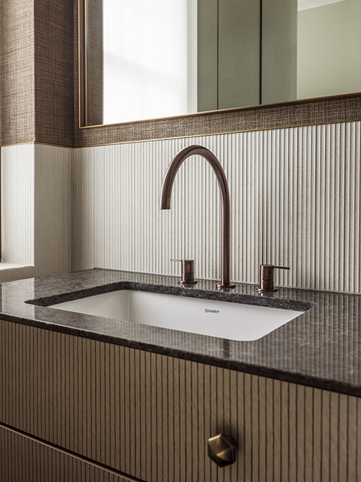 bespoke bathroom vanity with textured door fronts, tiles and wall covering