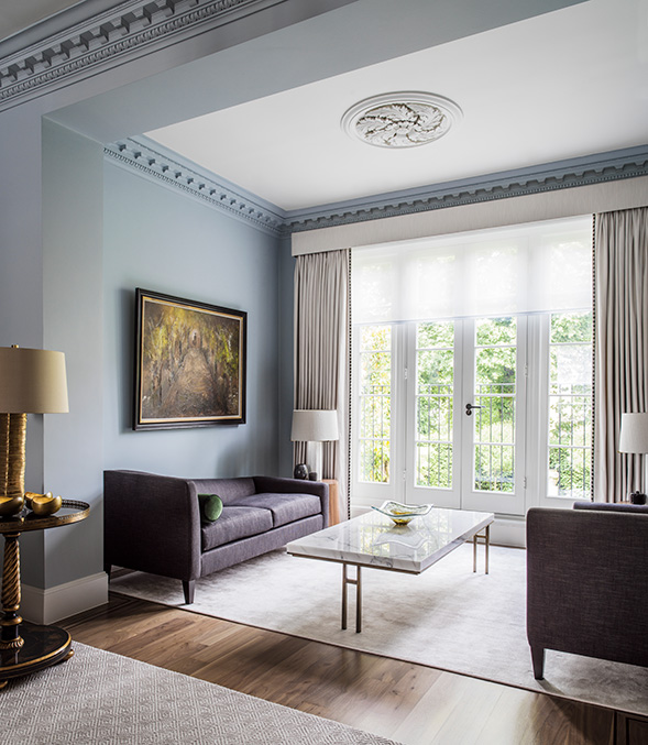 elegant living room with bespoke marble coffee table and dark grey sofas