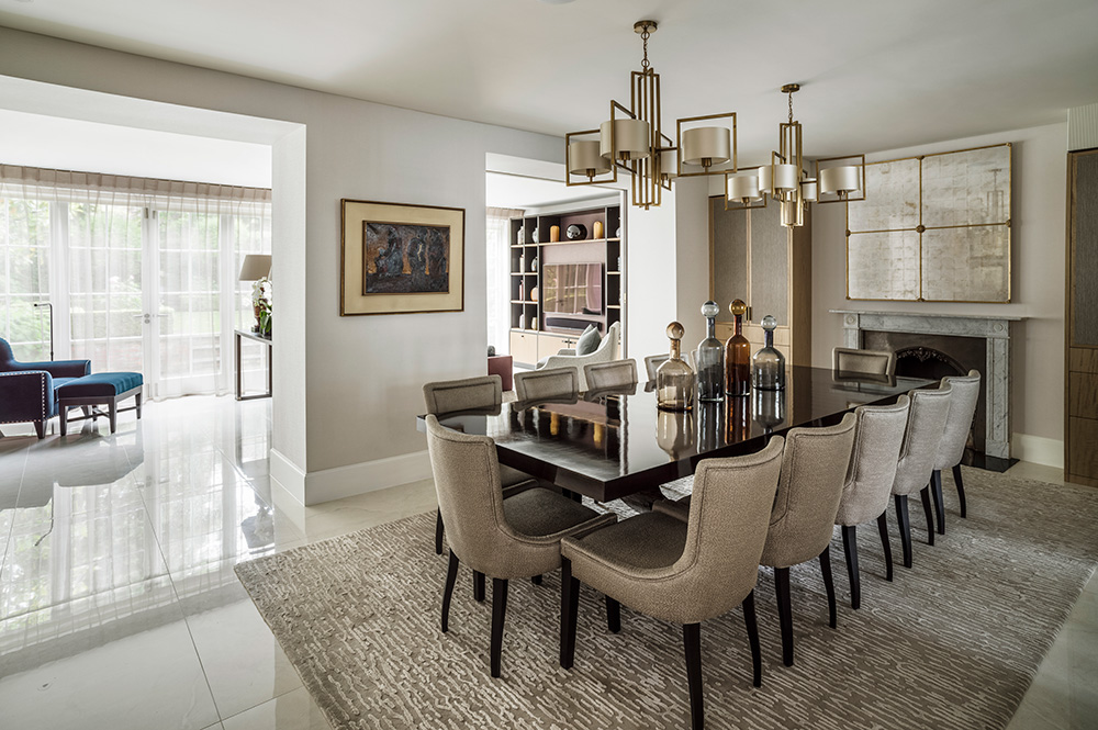 large gloss timber dining table with elegant dining chairs and pendant lights