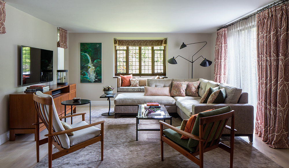 eclectic living room with large L-shaped sofa and bay window seating