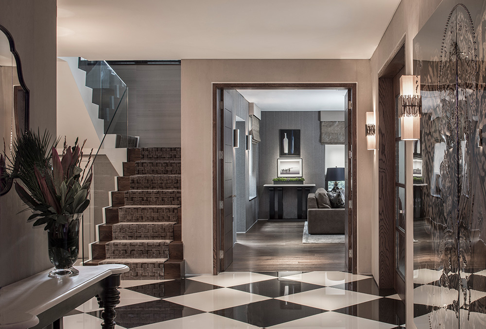 luxury entrance hallway with staircase and chequered flooring