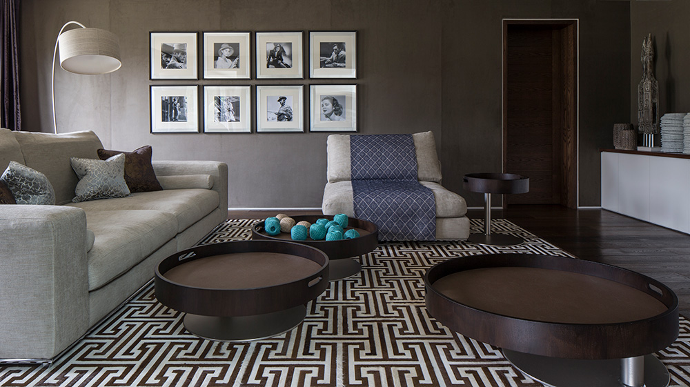 media room with large sofa and modular coffee tables