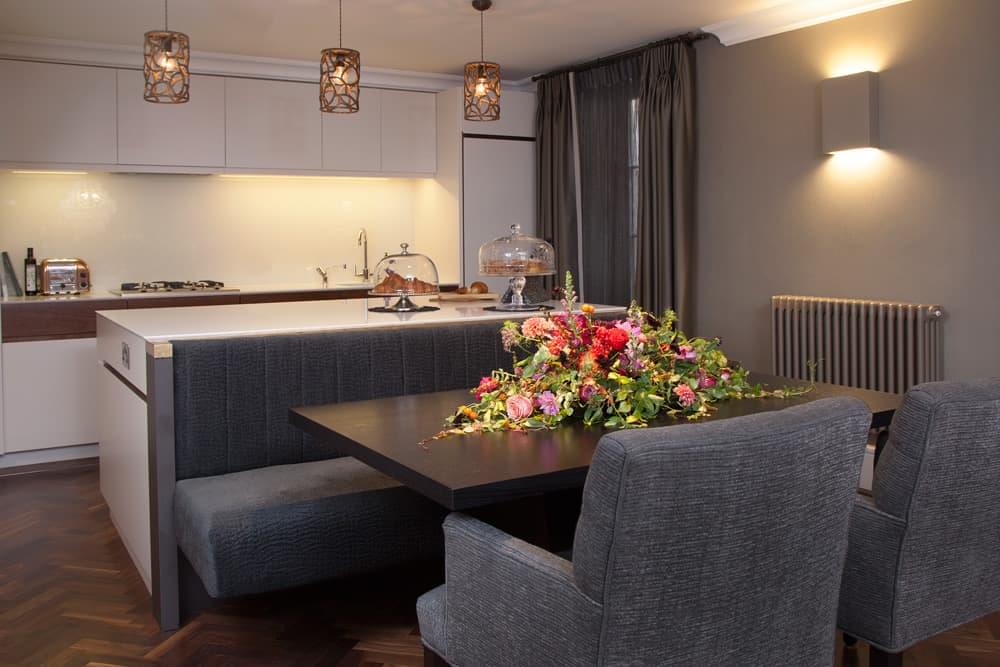 Breakfast Nook Bespoke banquette-style seating has been built into the kitchen island to create a sociable eating area. 